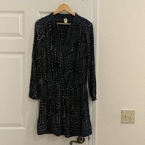 Long sleeve, knee length dress.